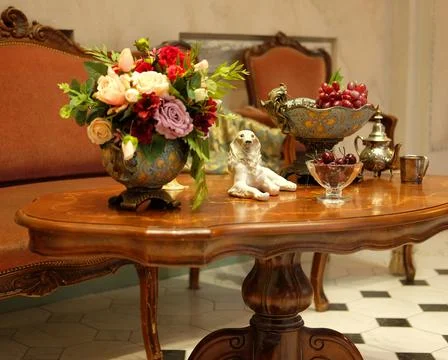A beautiful table in an elegant interior, luxurious style, there is a vase of Stock Photos