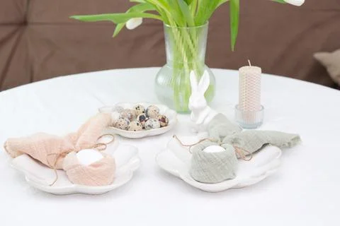 Beautiful table serving for Easter celebration in dining room, plates with Foto stock