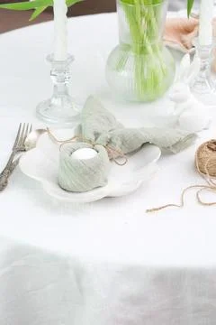 Beautiful table serving for Easter celebration in dining room, plate with easter Foto stock