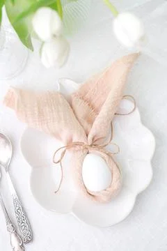 Beautiful table serving for Easter celebration in dining room, plate with easter Stock Photos