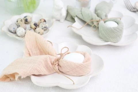 Beautiful table serving for Easter celebration in dining room, plates with Stock Photos