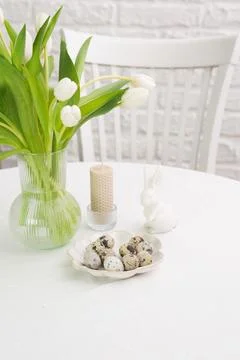 Beautiful table serving for Easter celebration in dining room, plates with Foto stock
