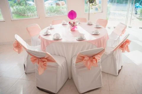Beautiful table setting for a banquet evening in pink. Stock Photos