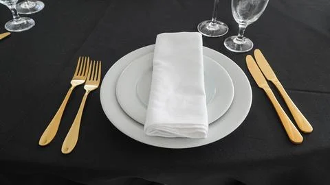 Beautiful table setting on black background. Stock Photos