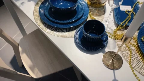 Beautiful table setting with Christmas decorations in living room. Dinner or Stock Footage 224851072