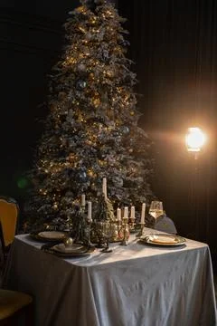 Beautiful table setting with Christmas decorations in living room Stock Photos