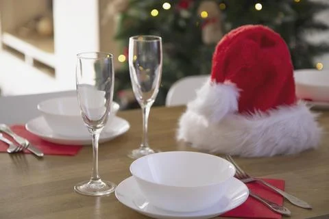 Beautiful table setting for the Christmas dinner with transparent glasses and Stock Photos