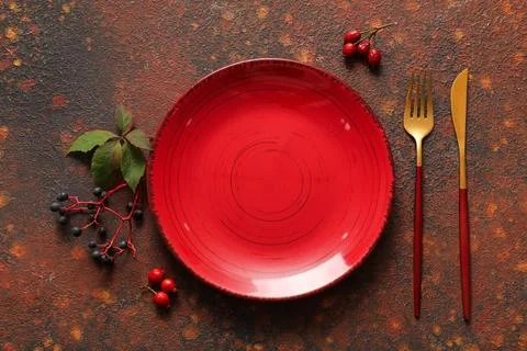 Beautiful table setting with different berries on dark background Stock Photos