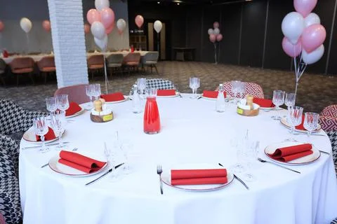Beautiful table setting with dishes and flowers for a party, birthday, reception Stock Photos
