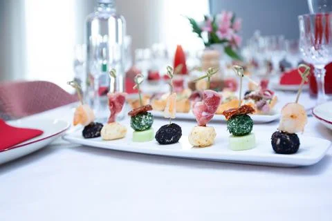 Beautiful table setting with dishes and flowers for a party, birthday, reception Stock Photos