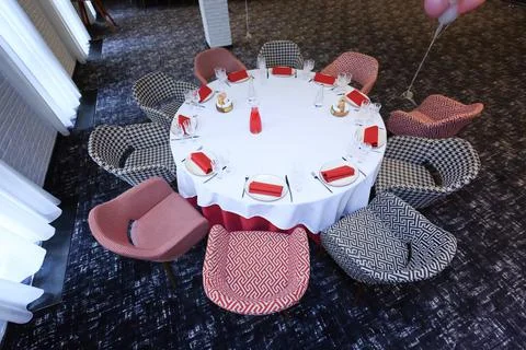 Beautiful table setting with dishes and flowers for a party, birthday, reception Stock Photos