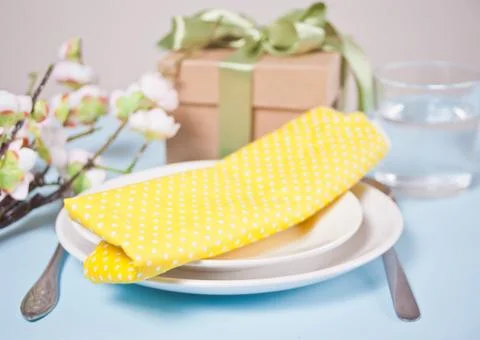 Beautiful table setting for Easter day decorated cherry blossom branch. Stock Photos