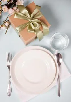 Beautiful table setting for Easter day decorated cherry blossom branch. Stock Photos