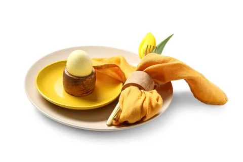 Beautiful table setting with Easter egg and yellow tulip flower on white back Stock Photos