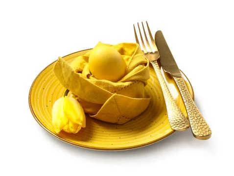 Beautiful table setting with Easter egg and yellow tulip flower on white back Stock Photos