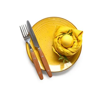Beautiful table setting with Easter egg and leaves on white background Stock Photos