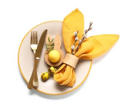 Beautiful table setting with Easter eggs and pussy willow branches on white b Stock Photos