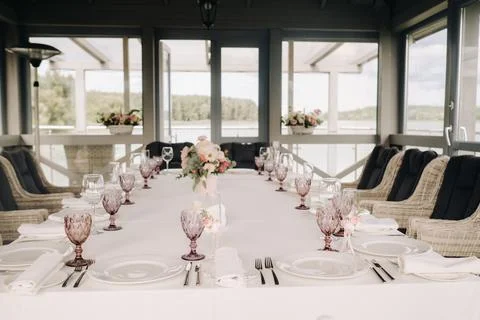 Beautiful table setting with floral decor for a holiday Stock Photos