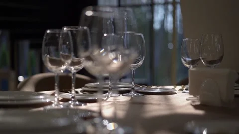 Beautiful table setting with glasses, plates and napkins. Clouse-up. Stock Footage 159368875