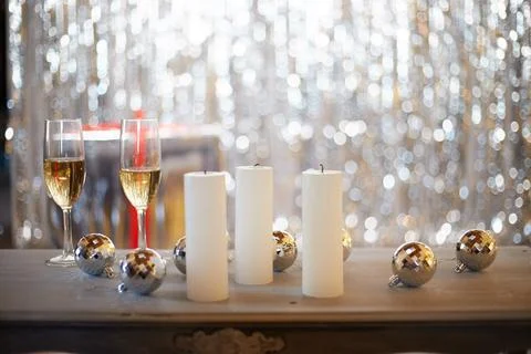 Beautiful table setting with glasses of wine, candles and rose against blurre Stock Photos