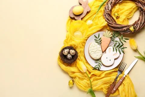 Beautiful table setting with sweet cookies, Easter eggs and tulip flowers on  Stock Photos