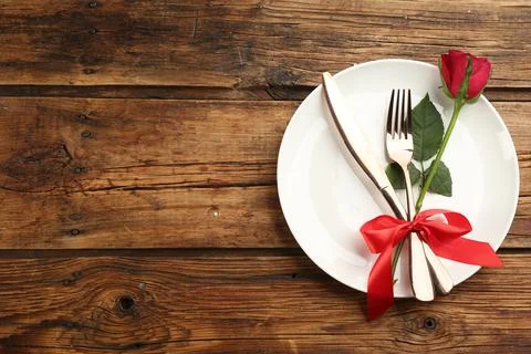 Beautiful table setting on wooden background, top view with space for text. V Stock Photos