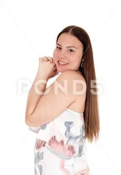 A beautiful teenager girl standing waist up in profile Stock Photos