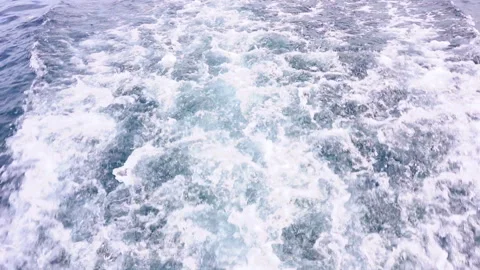 Beautiful texture of dark ocean waves with white wash from boat activity. Stock-Footage 248143789