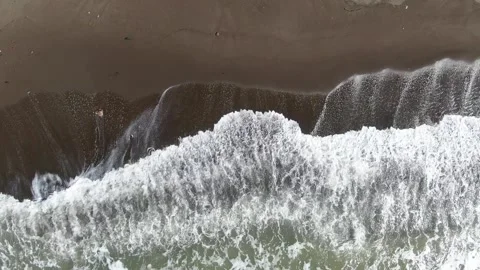Beautiful texture of dark sea waves of high power with a white tint. Bird's-eye Stock Footage 232878943