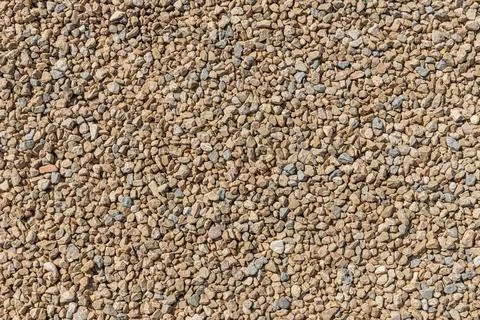 A beautiful texture of path or wall of orange and yellow stones is in the par Stock Photos