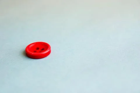 Beautiful texture with a round button for sewing, needlework. Copy space. Fla Stock Photos