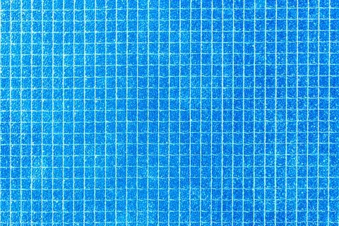 Beautiful textured background made of a grid of blue squares. Stock Photos