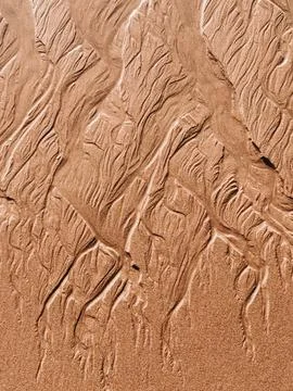 Beautiful textured pattern in the sand background Stock Photos
