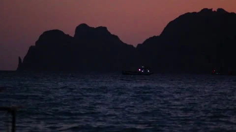 Beautiful Thai bay at Phi Phi Island. Speed boat near Phi Phi at sunset Stock-Footage 60953219