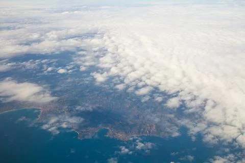 Beautiful thick clouds in the sky from the height of the flight of the plan.. Stock Photos