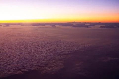 Beautiful thick clouds in the sky from the height of the flight of the airp.. Stock Photos