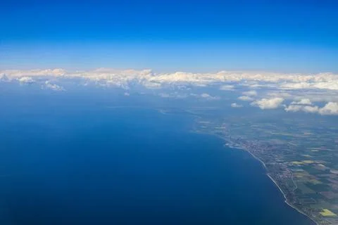 Beautiful thick clouds in the sky from the height of the flight of the plan.. Stock Photos