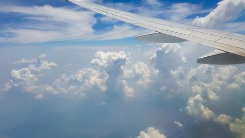 Beautiful thick clouds in the sky from the height of the flight of the plan.. Stock Photos