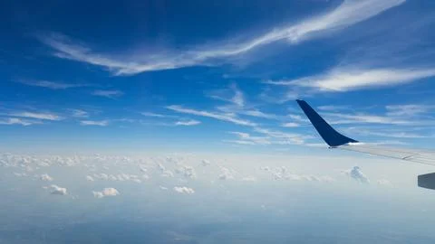 Beautiful thick clouds in the sky from the height of the flight of the plan.. Stock Photos