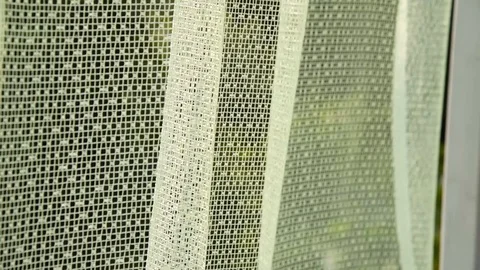 Beautiful thin curtain moves in the wind against the backdrop of a green gard Stock Footage 105462645