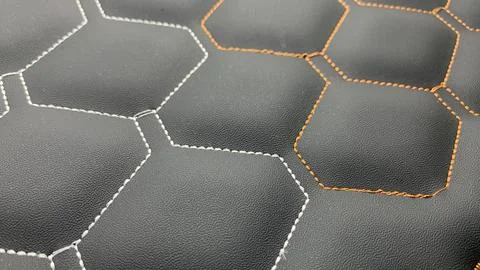 Beautiful thread stitching on the black leather. Stock Photos