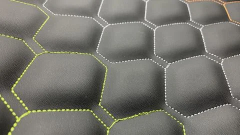 Beautiful thread stitching on the black leather. Stock Photos