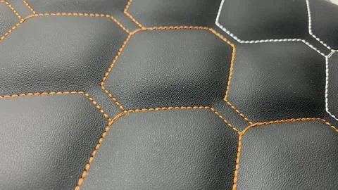 Beautiful thread stitching on the black leather. Stock Photos