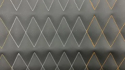 Beautiful thread stitching on the black leather. Stock Photos