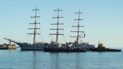 A beautiful three-sailing ship is sailing to the port 4k Stock Footage 113879509