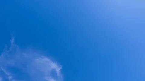 Beautiful time-lapse clouds on a background of blue sky video loop Stock Footage 93630732