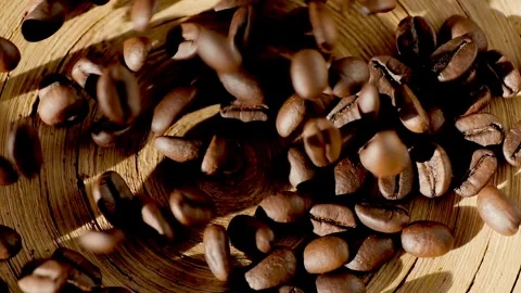 Beautiful time-lapse footage of falling coffee beans 4K. Slow motion of roasted Stock Footage 267259024