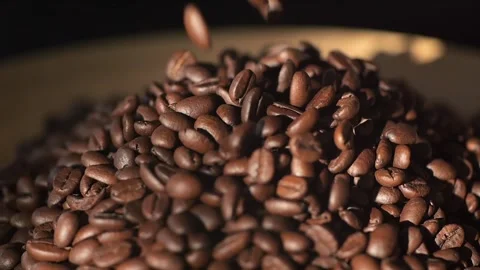 Beautiful time-lapse footage of falling coffee beans 4K. Slow motion of roasted Stock Footage 267788798