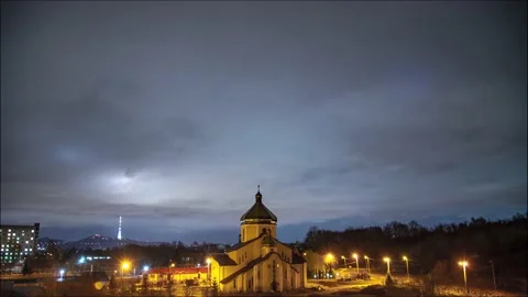 Beautiful time lapse: massive clouds floating night city sky. Stock Footage 130352254