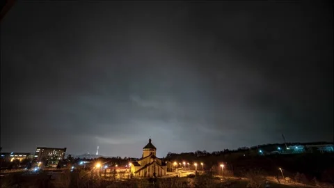 Beautiful time lapse: massive clouds floating night city sky. Stock Footage 131007801